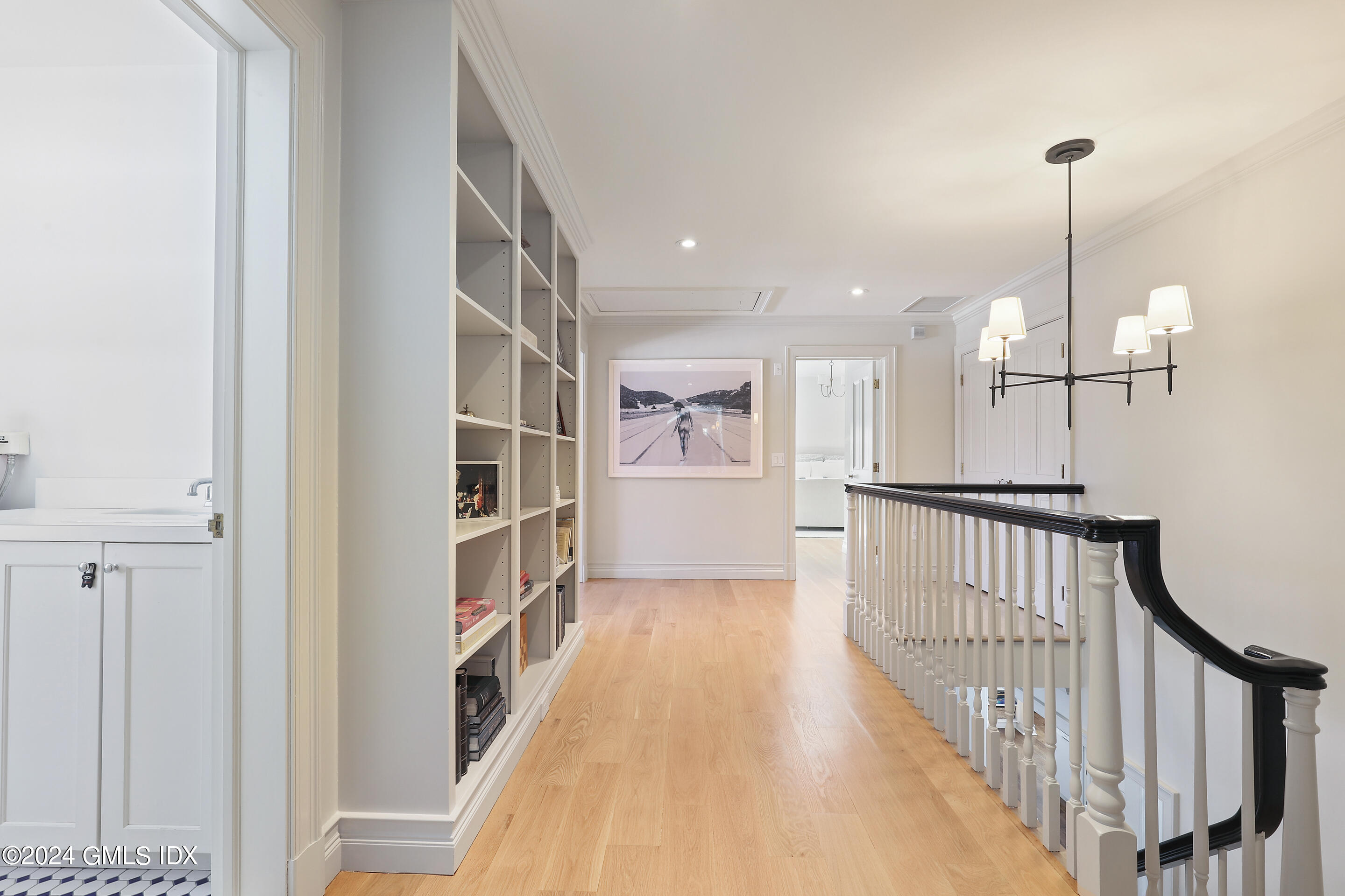 Undisclosed Address Greenwich, CT 06830 - Photo 10 of 19 a view of a hallway with wooden floor and staircase