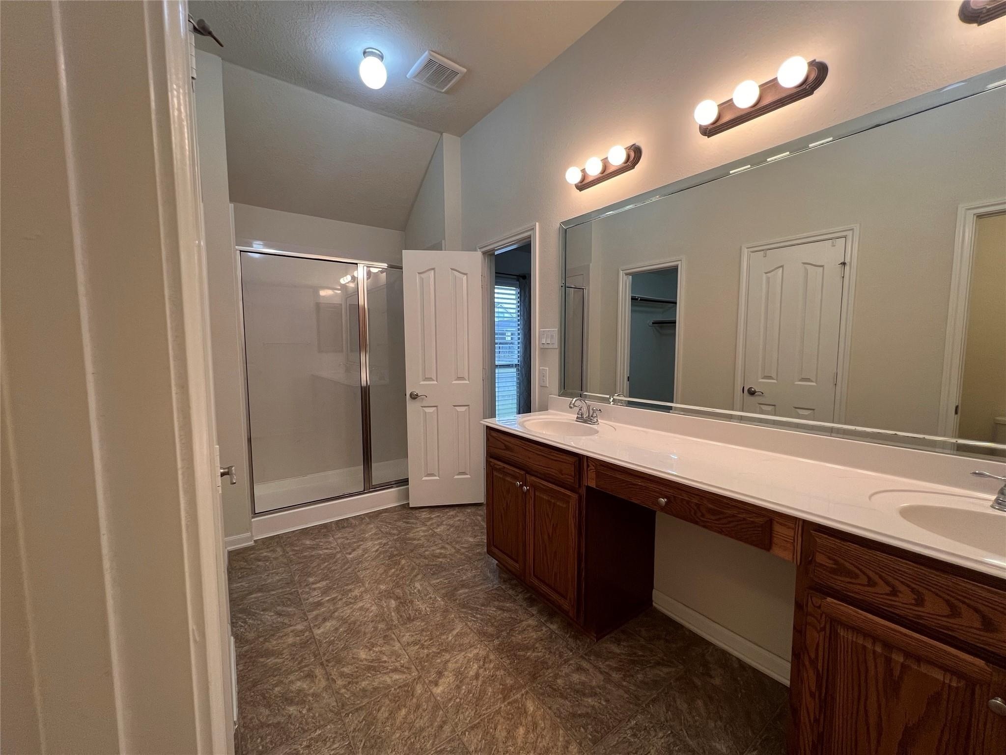 2502 Redrock Road League City, TX 77573 - Photo 10 of 19 With dual sinks and a generously sized vanity, there’s plenty of room for everyone to get ready without competing for space.