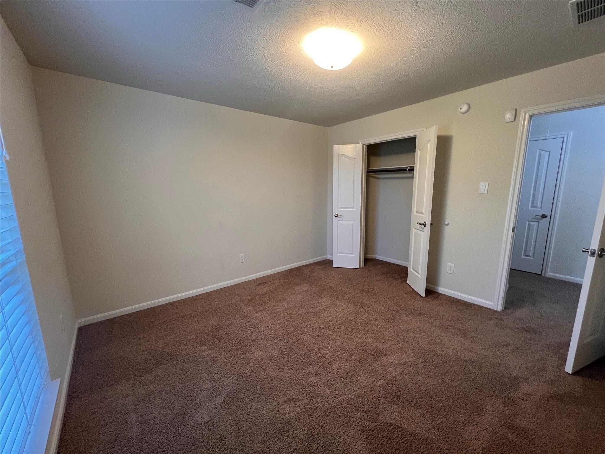 2502 Redrock Road League City, TX 77573 - Photo 13 of 19 Ample natural light and plenty of storage space are found in each secondary bedroom.