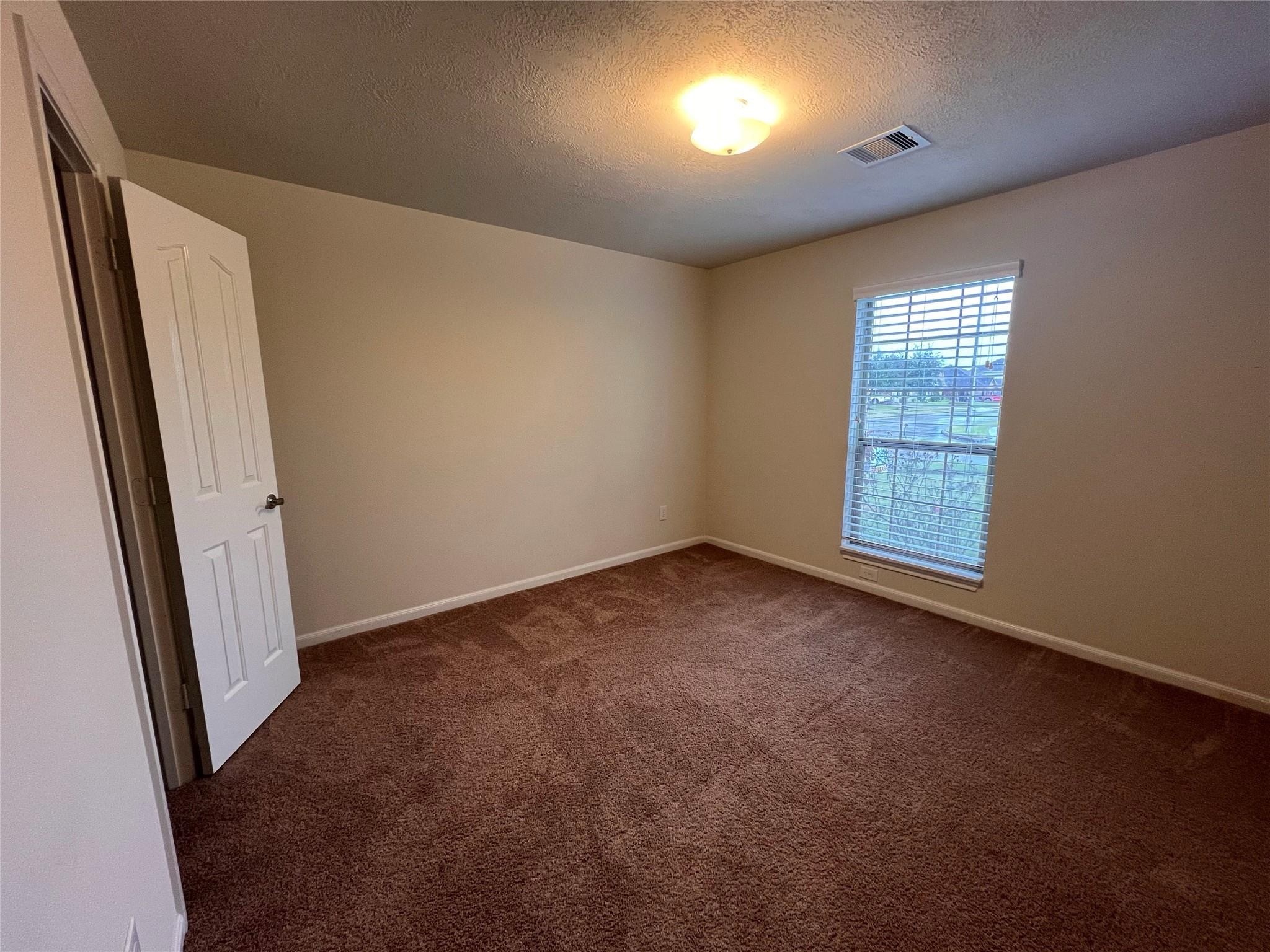 2502 Redrock Road League City, TX 77573 - Photo 14 of 19 Ample natural light and plenty of storage space are found in each secondary bedroom.
