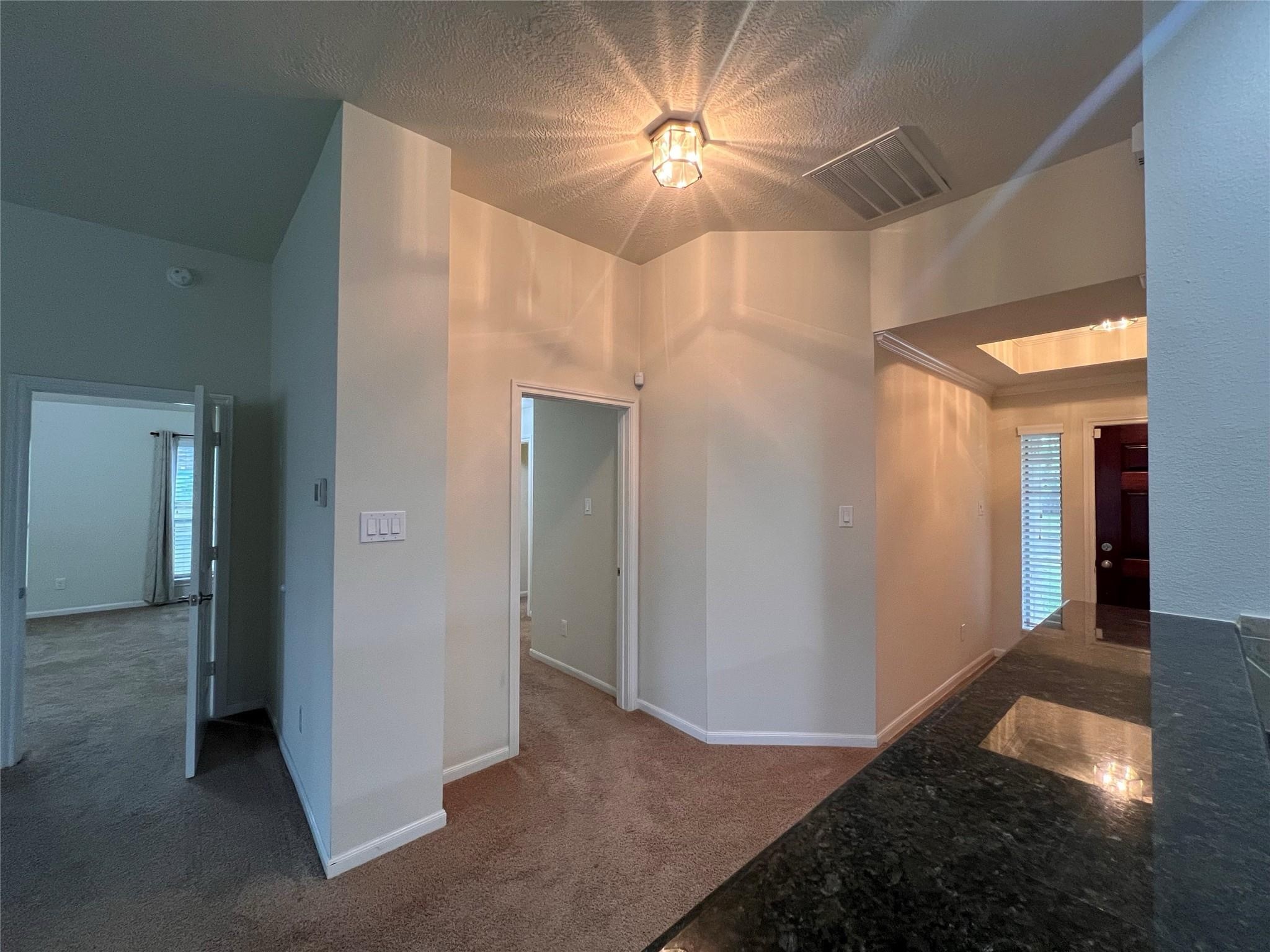 2502 Redrock Road League City, TX 77573 - Photo 2 of 19 Entrance features trey ceiling and you'll find all bedrooms to the right of the home.