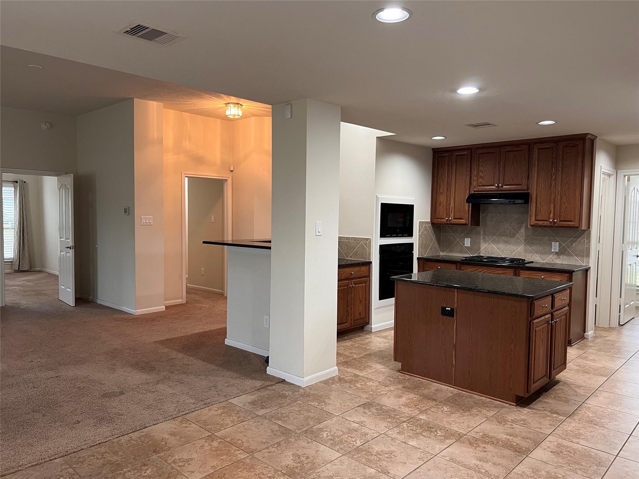 2502 Redrock Road League City, TX 77573 - Photo 3 of 19 The spacious kitchen dining area, and main living are thoughtfully designed to offer a seamless flow for both everyday living and entertaining.