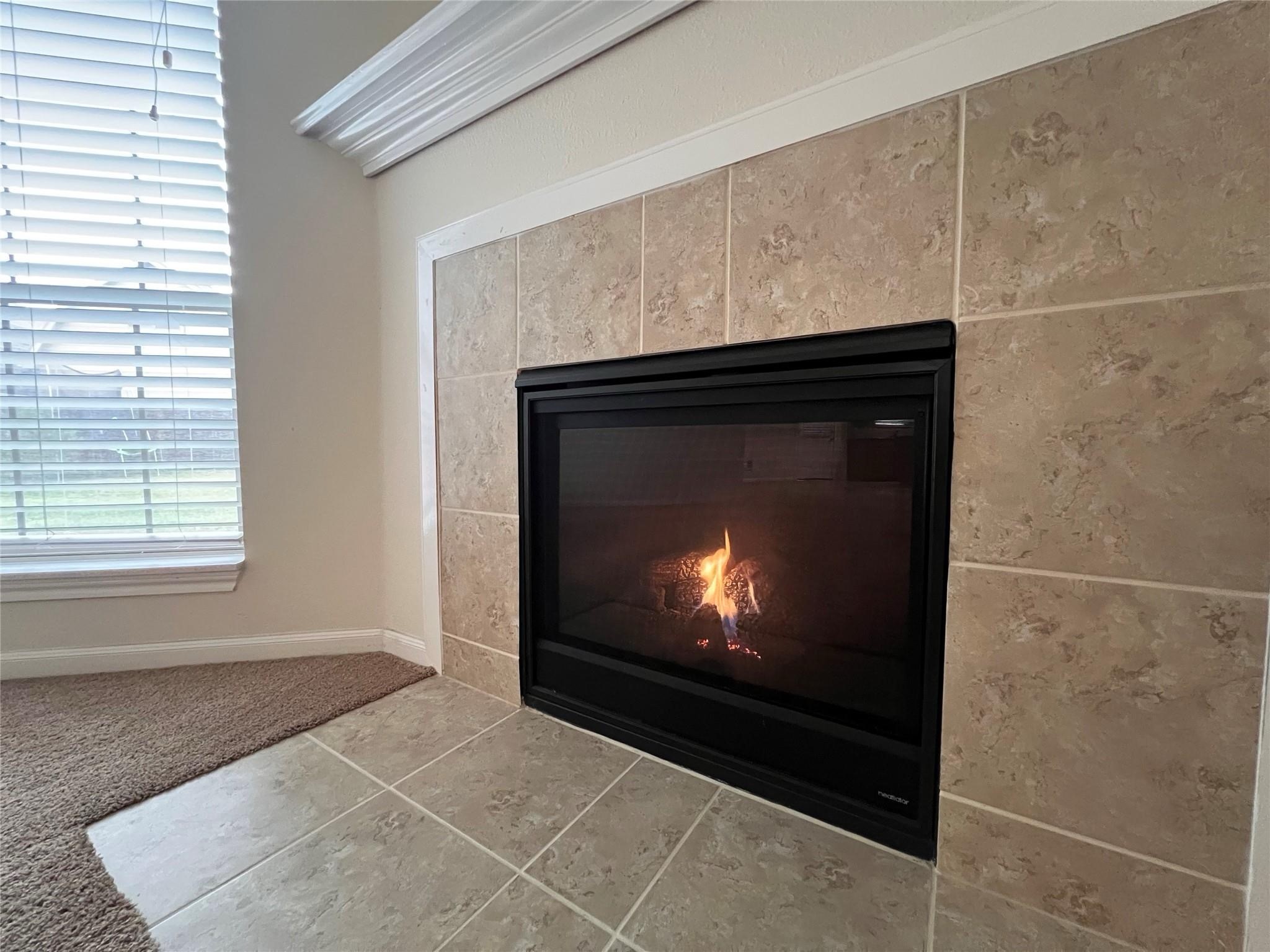 2502 Redrock Road League City, TX 77573 - Photo 6 of 19 A remote start fireplace provides effortless warmth and ambiance, adding a touch of cozy and convenience to your living space.