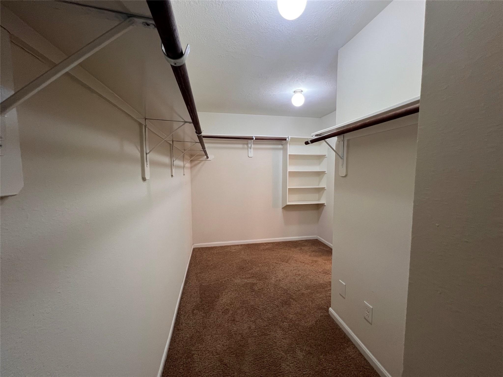 2502 Redrock Road League City, TX 77573 - Photo 9 of 19 The oversized walk-in closet offers ample space, perfect for adding custom organizers or dressers to maximize storage and functionality.
