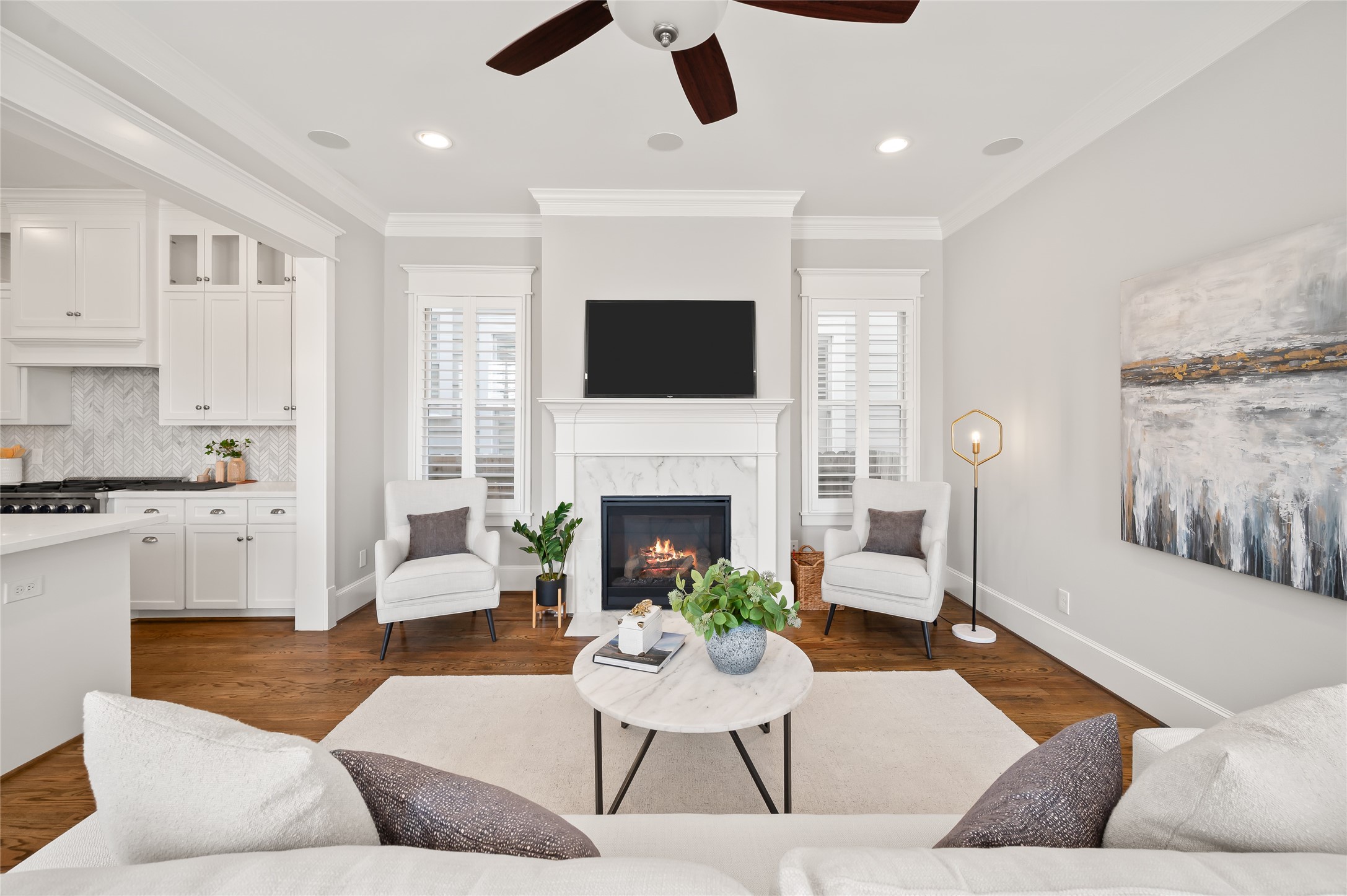 1003 East 25th Street Houston, TX 77009 - Photo 14 of 32 Anchored by a gas fireplace, the family room is perfect for entertaining. Never miss a beat with this open layout.