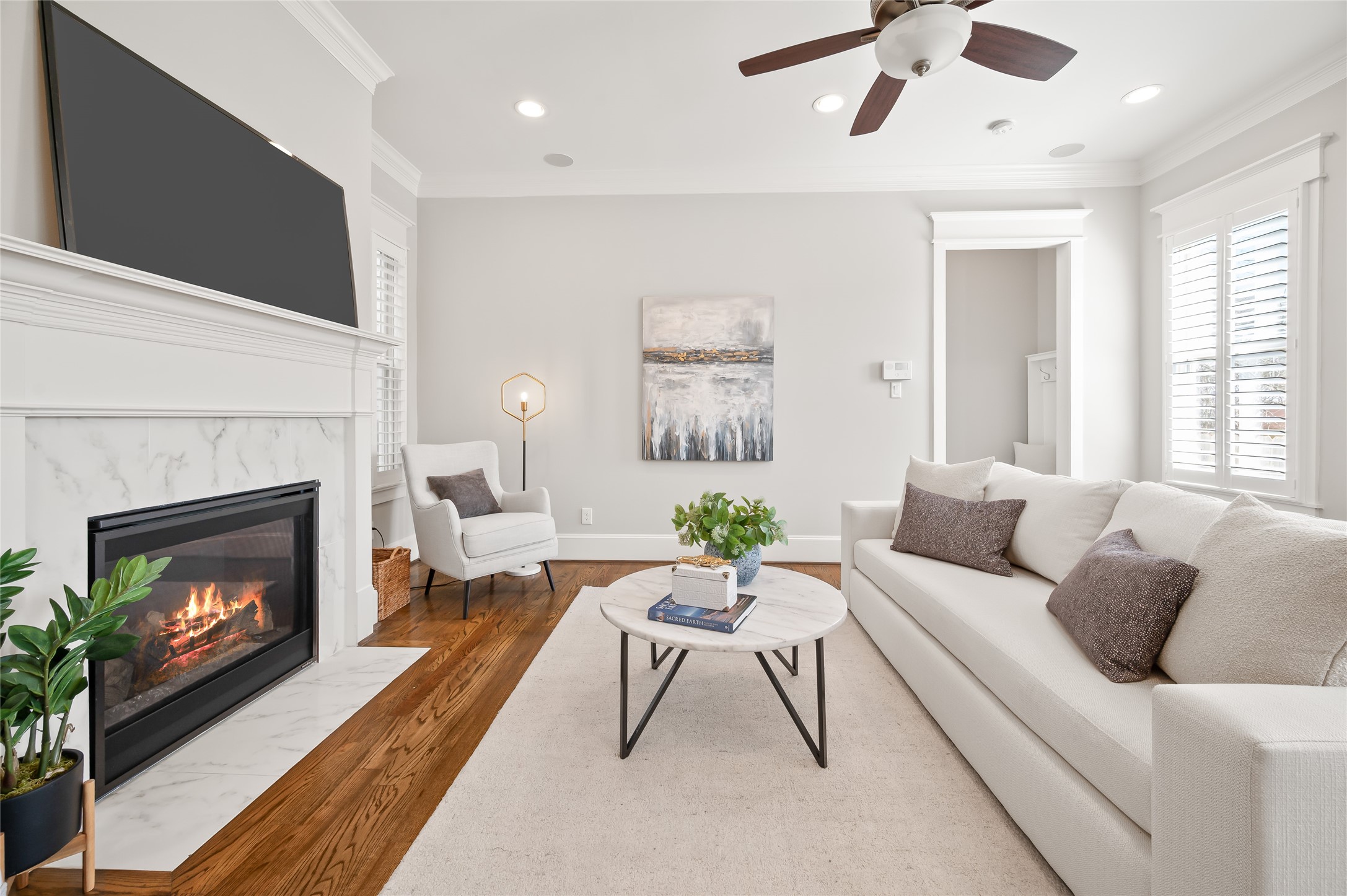 1003 East 25th Street Houston, TX 77009 - Photo 15 of 32 Additional view of the family room showcasing the fireplace with generous mantel and marble surround.