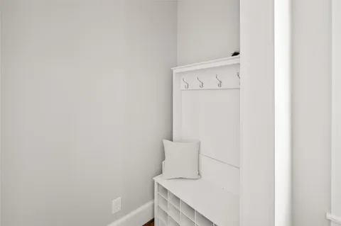 a bathroom with a sink a mirror and a window