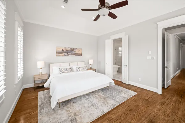 a bathroom with a sink vanity tub and a mirror