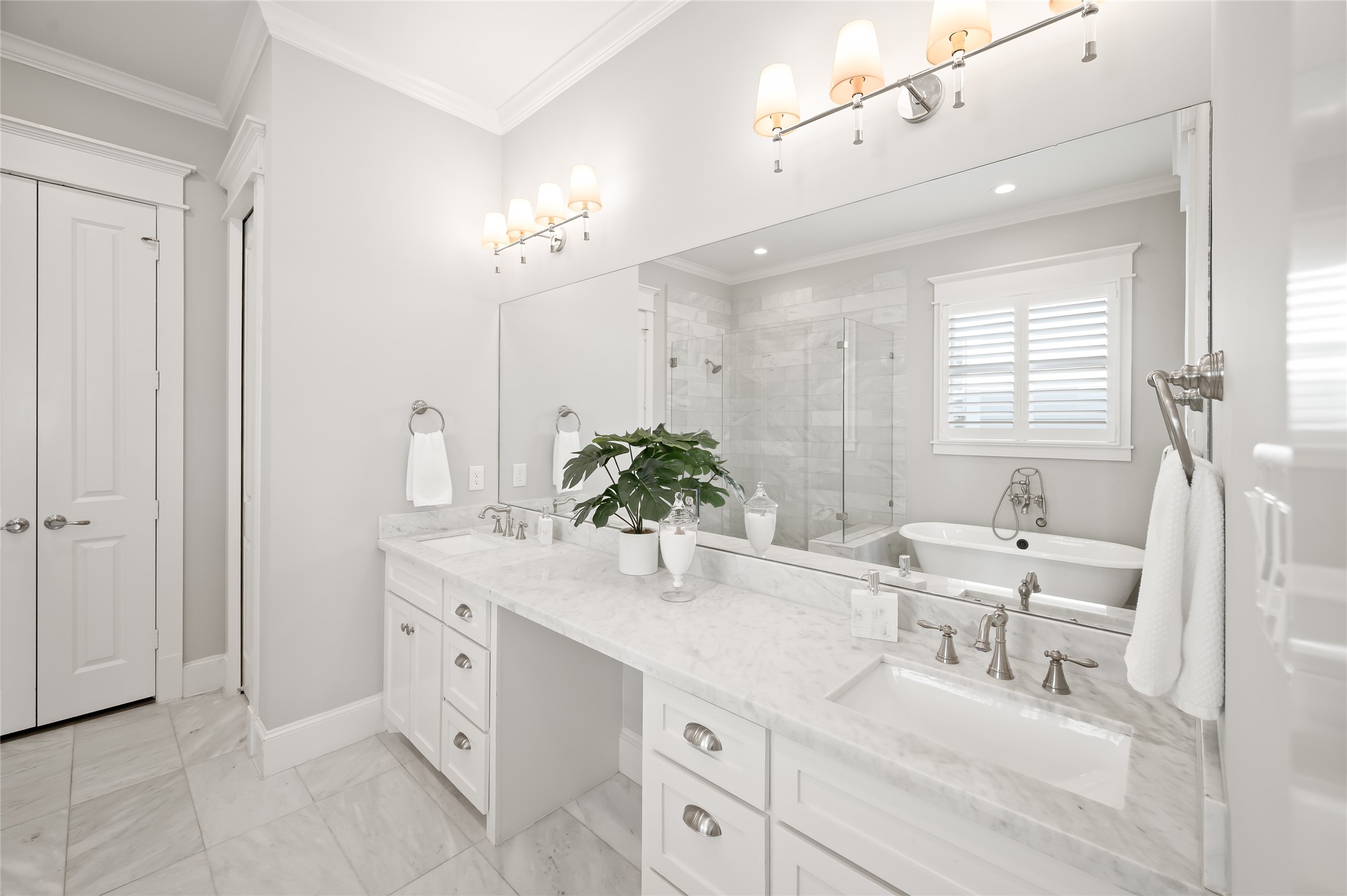 1003 East 25th Street Houston, TX 77009 - Photo 22 of 32 Marble countertop, dual vanity and a sitting area will make this feel like a nightly retreat.