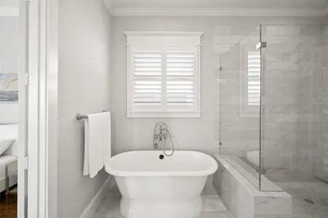 a bathroom with a double vanity sink toilet mirror and shower