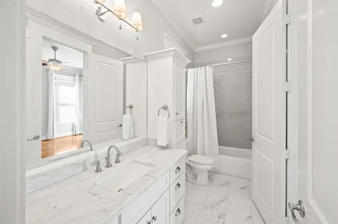 a picture of a bathroom with a shower