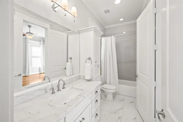 a picture of a bathroom with a shower