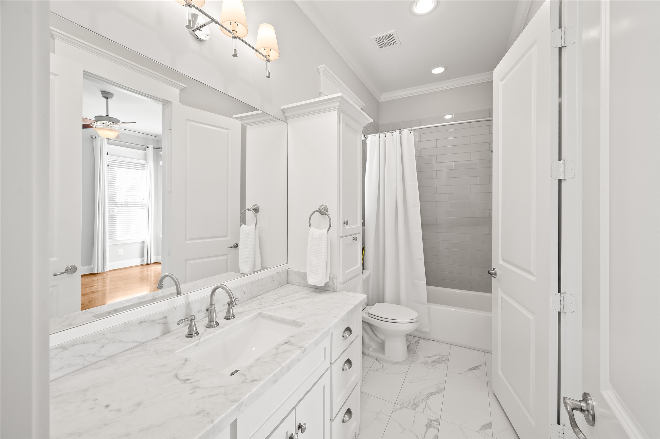 1003 East 25th Street Houston, TX 77009 - Photo 28 of 32 Updated secondary bath with quartz counters, flooring, and plenty of storage.