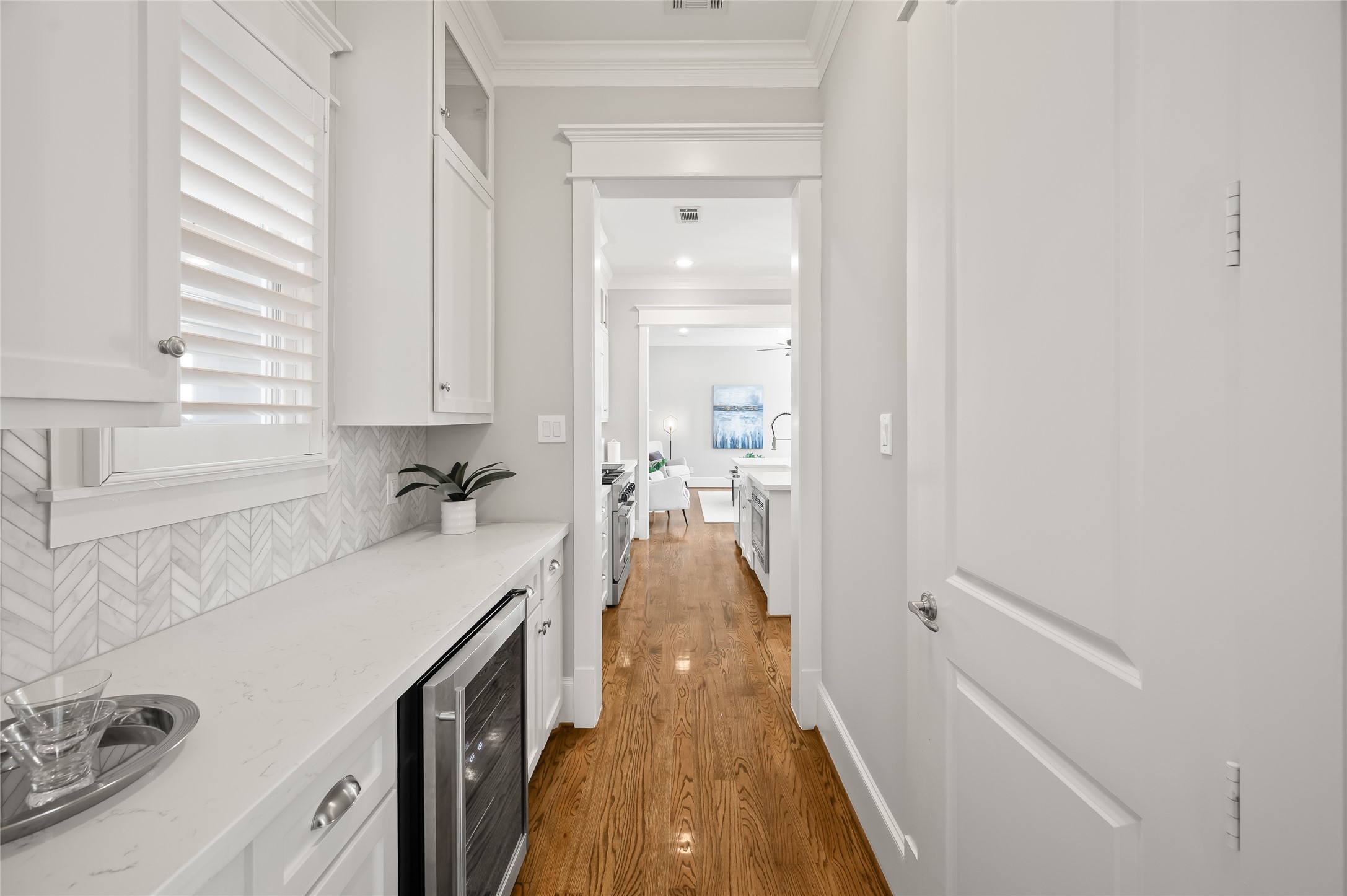 1003 East 25th Street Houston, TX 77009 - Photo 9 of 32 Between the dining room and kitchen is the well appointed butlers pantry complete with beverage cooler, extra cabinetry and pantry.
