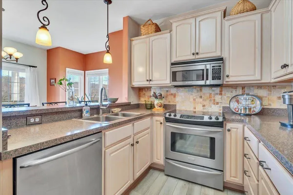 an aerial view of house with yard