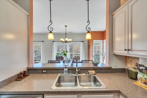 a front view of a house with a street