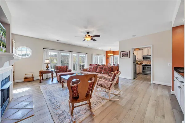 a living room with furniture a couch and a chandelier