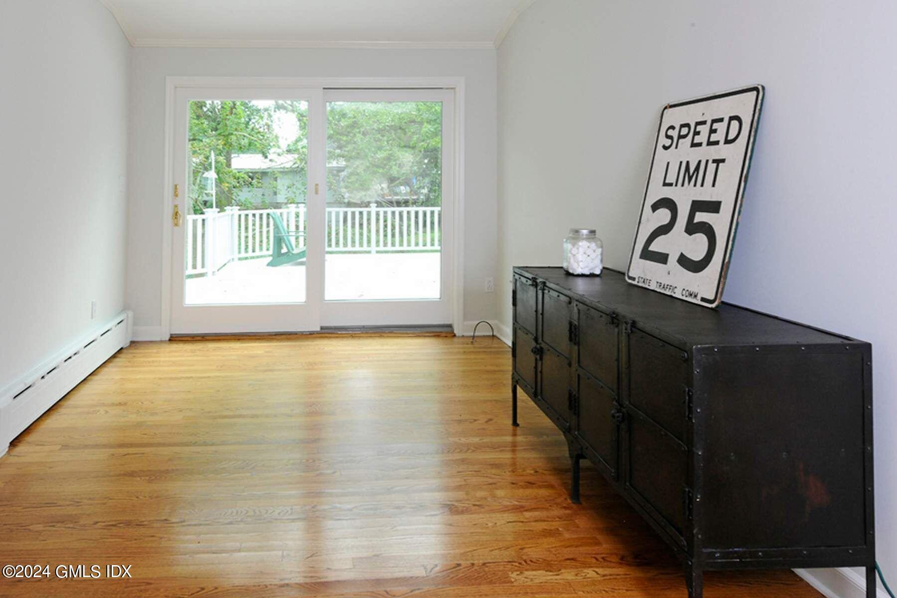 8 Indian Point Lane Riverside, CT 06878 - Photo 11 of 18 a view of an empty room with wooden floor and a window