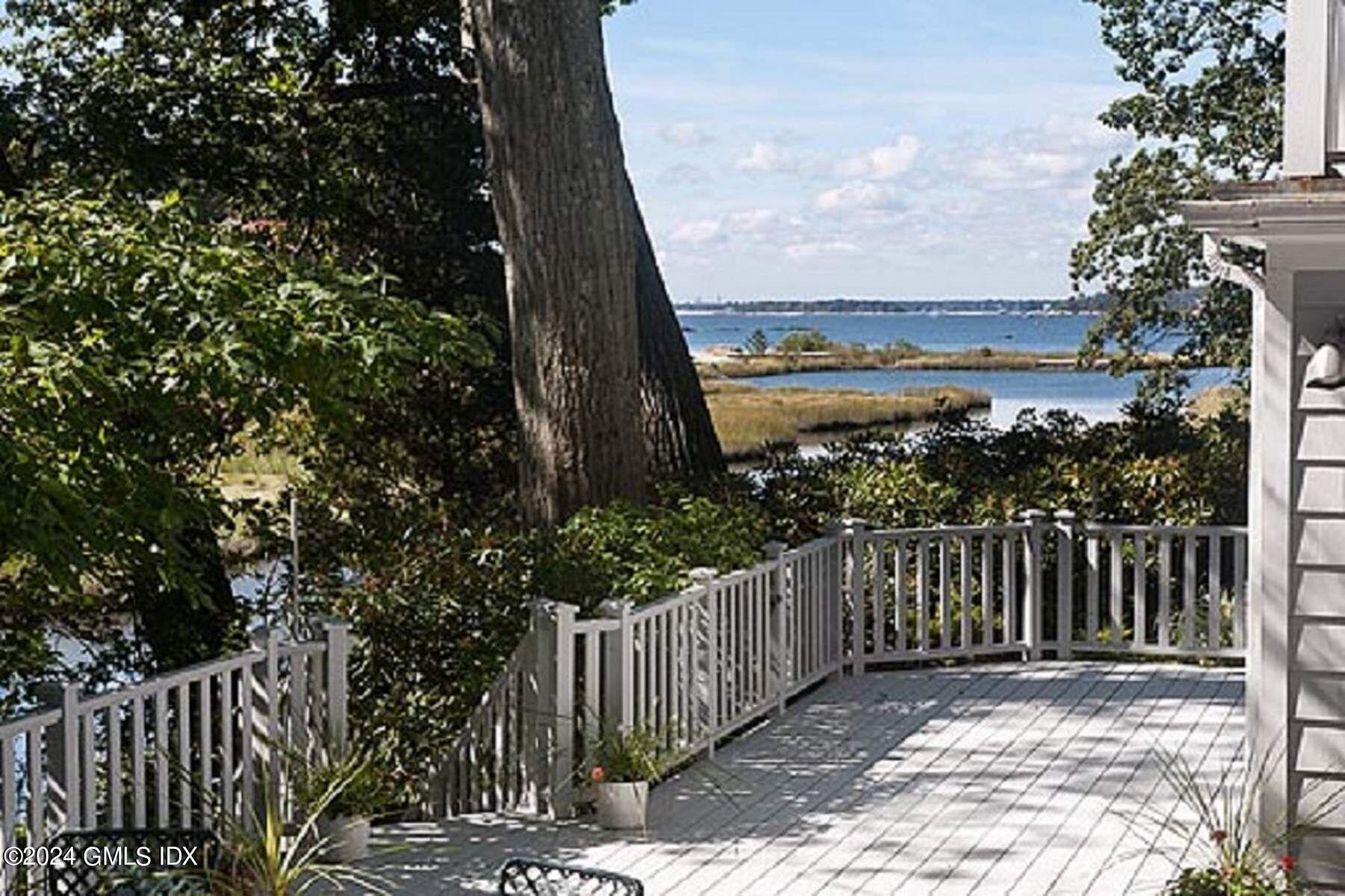 8 Indian Point Lane Riverside, CT 06878 - Photo 13 of 18 a view of a balcony with wooden fence