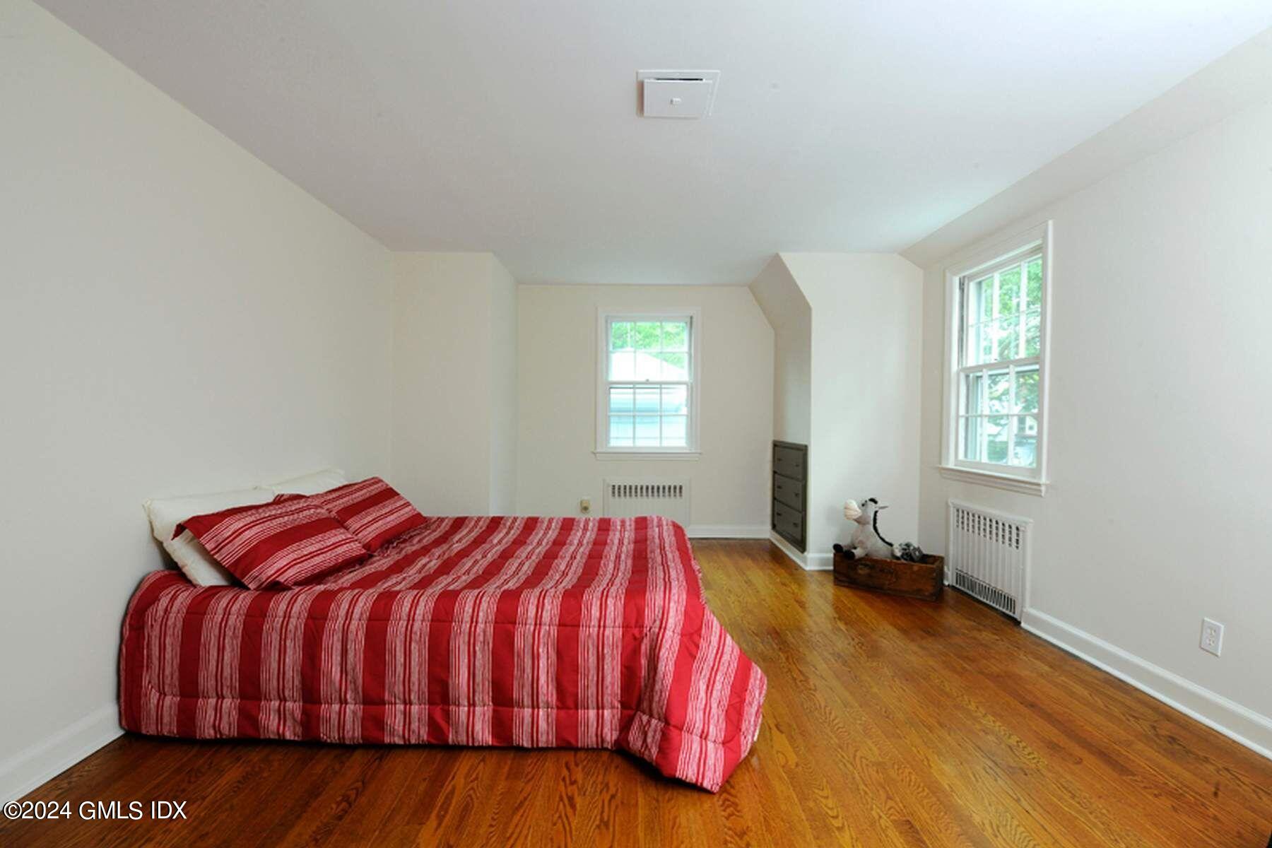 8 Indian Point Lane Riverside, CT 06878 - Photo 15 of 18 a bedroom with a bed and window