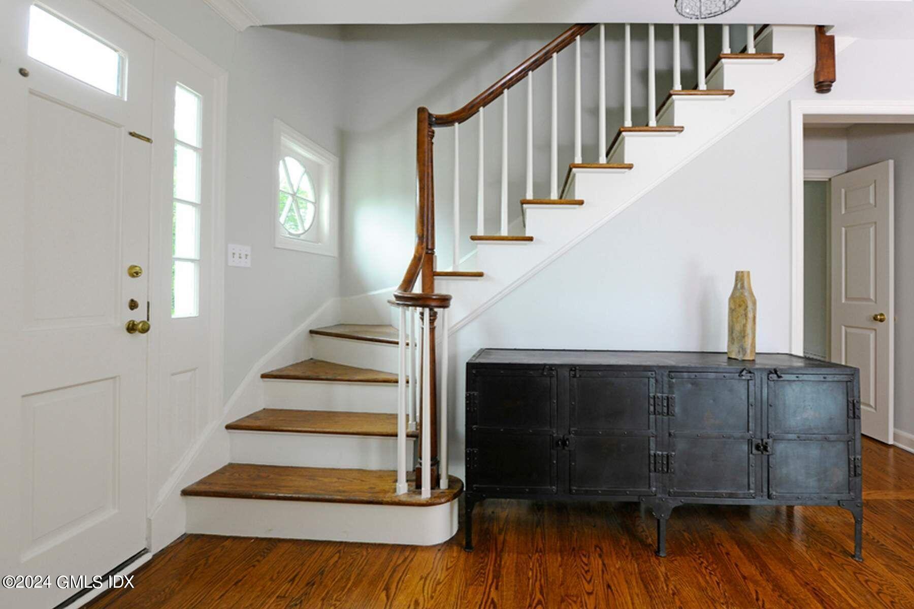 8 Indian Point Lane Riverside, CT 06878 - Photo 4 of 18 a view of entryway and hall with wooden floor