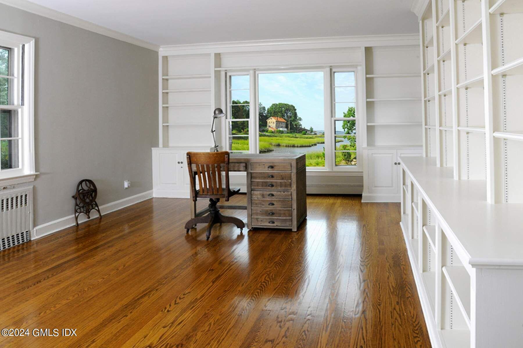 8 Indian Point Lane Riverside, CT 06878 - Photo 7 of 18 a living room with furniture and a large window