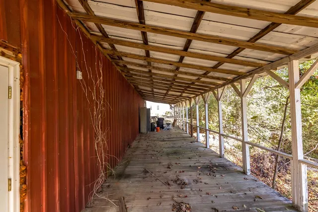 a view of a chairs and table in a patio