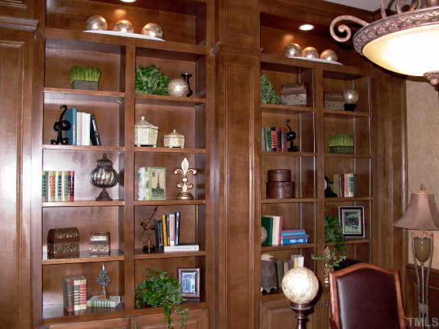 3915 Morvan Way Raleigh, NC 27612 - Photo 3 of 12 Beautiful stained built in bookcase in study with exquisitely crafted trimmed ceiling. 5 1/4 inch plank hardwood flooring.