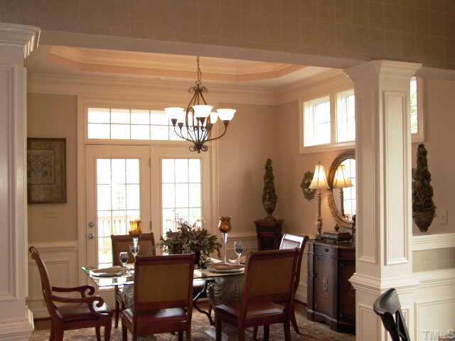 3915 Morvan Way Raleigh, NC 27612 - Photo 7 of 12 The perfect dining room experience for friends & family. It is open to the breakfast nook & family room. Great for entertaining. The double french door leads to a partially covered deck and staircase to the lower level patio.