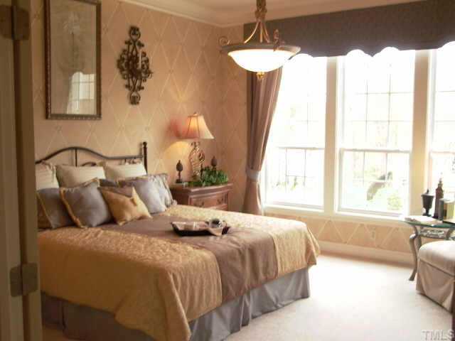 3915 Morvan Way Raleigh, NC 27612 - Photo 9 of 12 Lovely first floor master suite with exquisite crown moulding, double trey ceiling and audio speakers.