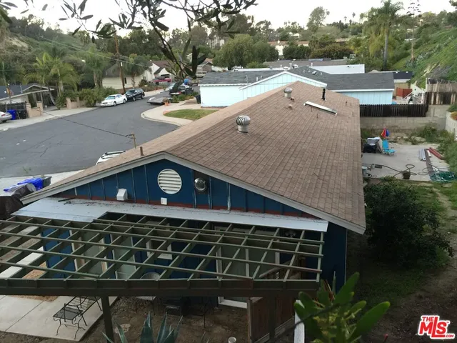 a view of a street with cars on road