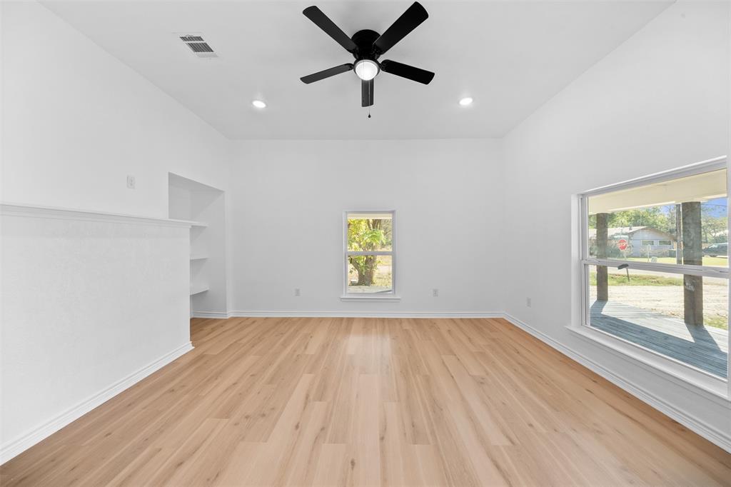 507 2nd Street Moody, TX 76557 - Photo 11 of 40 wooden floor in an empty room with a window