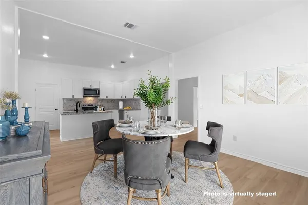a view of kitchen with wooden floor