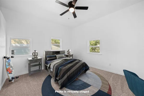 a bed room with a bed and a window