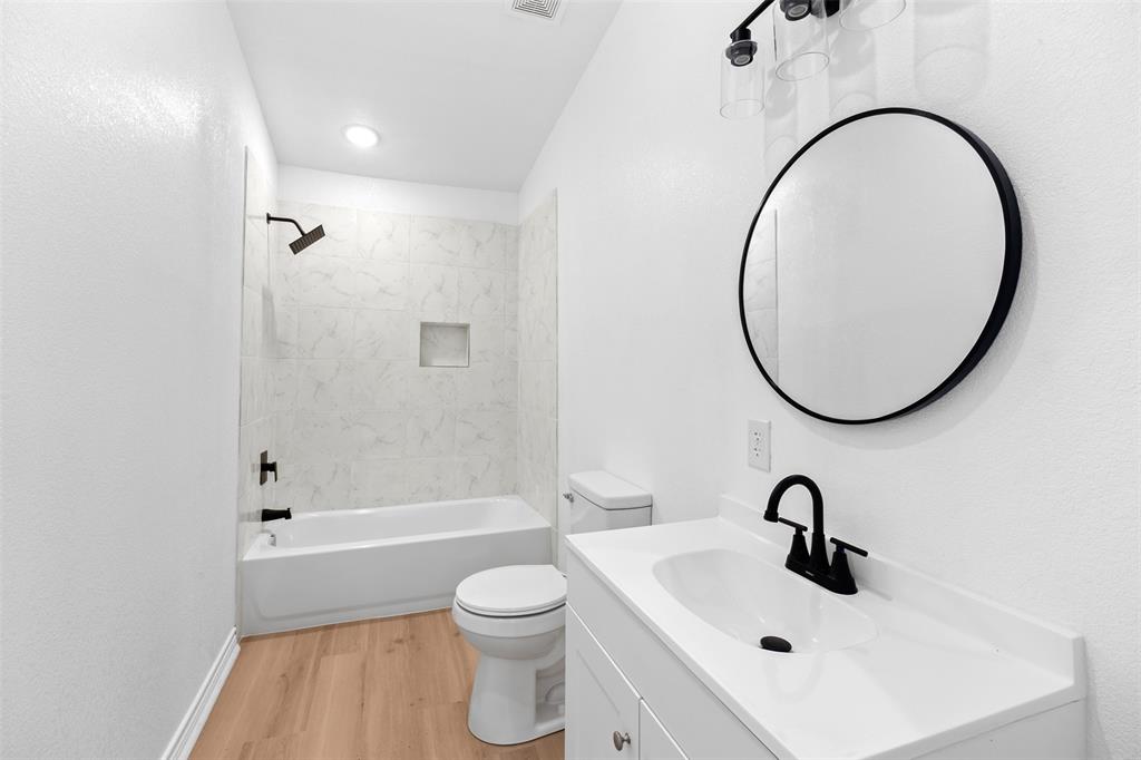 507 2nd Street Moody, TX 76557 - Photo 25 of 40 a bathroom with a sink a toilet and a mirror