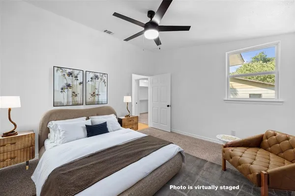 a bedroom with bed and furniture