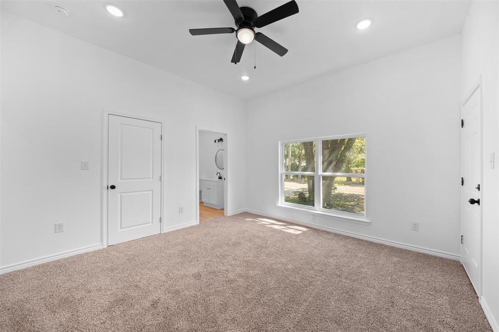 507 2nd Street Moody, TX 76557 - Photo 29 of 40 an empty room with a ceiling fan and window