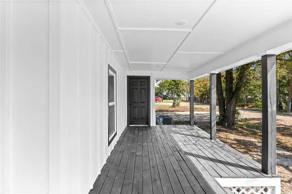 a living room with furniture a ceiling fan and a wooden floor