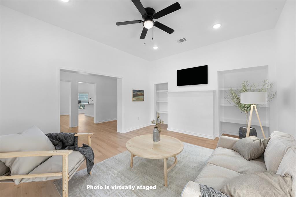 507 2nd Street Moody, TX 76557 - Photo 8 of 40 a living room with furniture a ceiling fan and a wooden floor