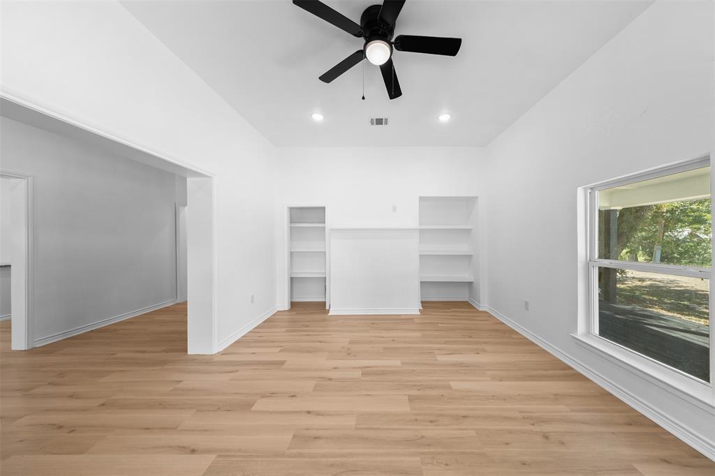 507 2nd Street Moody, TX 76557 - Photo 10 of 40 a view of empty room with wooden floor and window