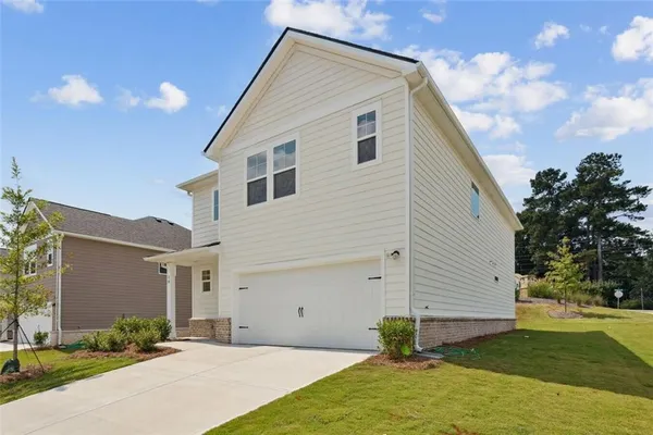 a view of a house with a yard