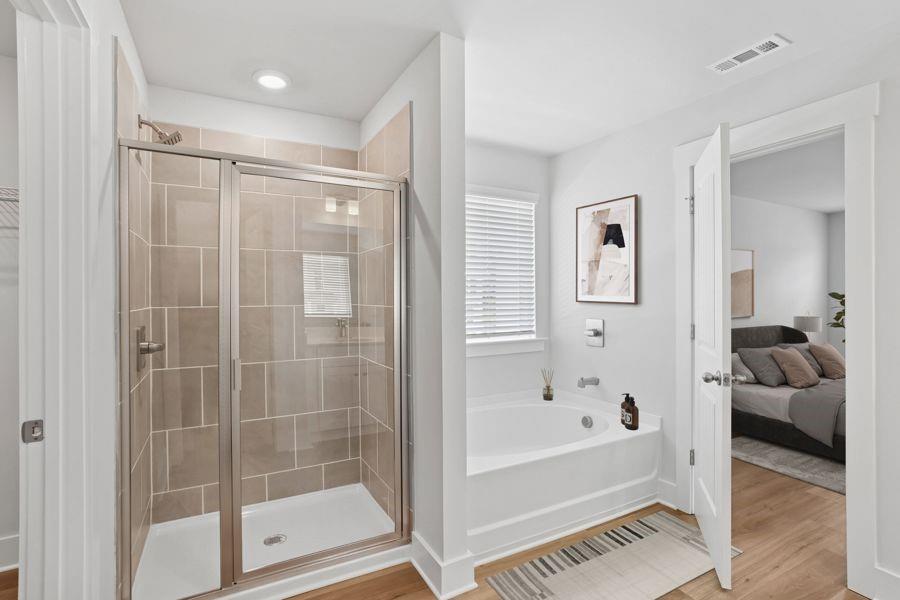 1575 Cedars Road Southeast, Unit REDBUD Lawrenceville, GA 30045 - Photo 15 of 17 a bathroom with a bathtub and a shower