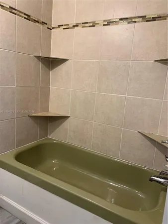a bathroom with a shower and a bathtub