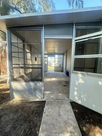 a view of a living room and entry way