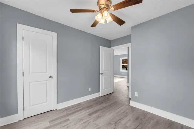 a view of kitchen with wooden floor washer and dryer
