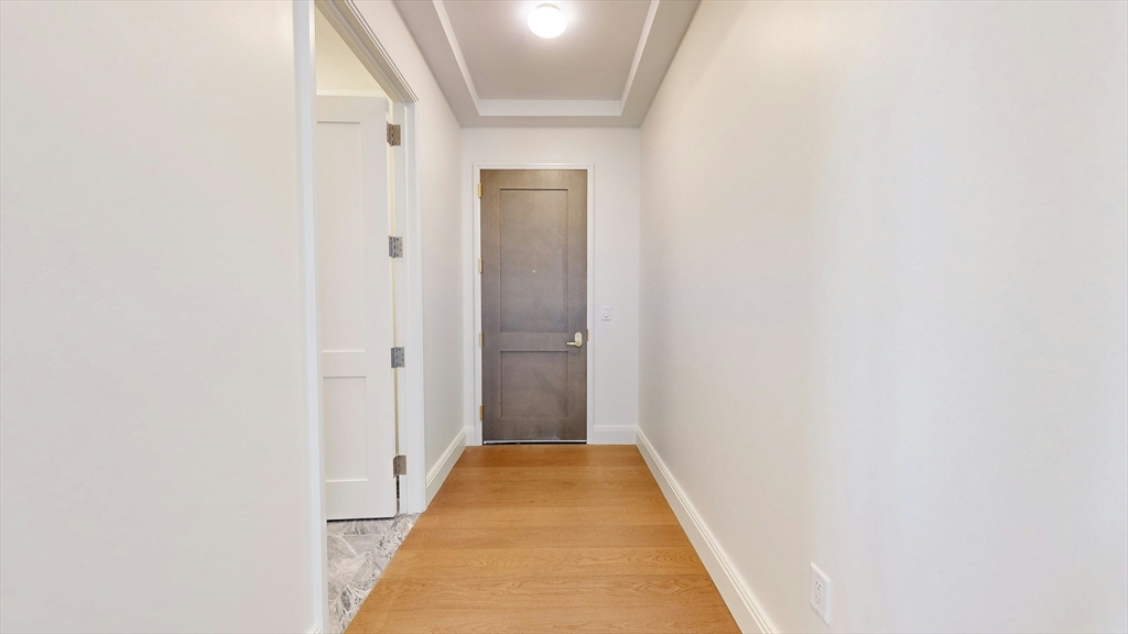 240 Devonshire Street, Unit 4708 Boston, MA 02110 - Photo 6 of 42 a view of a hallway with white walls