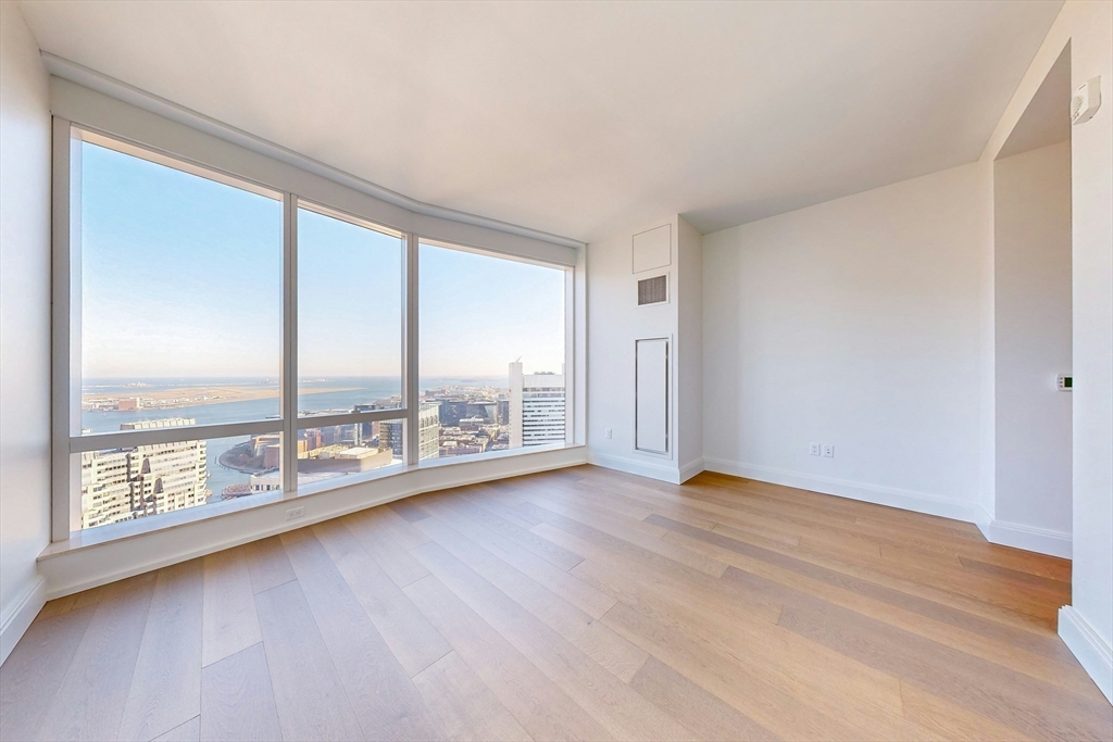 240 Devonshire Street, Unit 4708 Boston, MA 02110 - Photo 8 of 42 an empty room with large windows