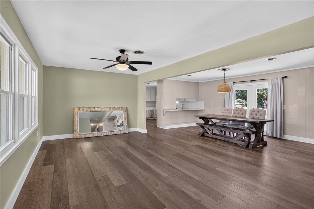 118 Bryson Road Anderson, SC 29625 - Photo 2 of 36 Rich hardwood floors sweep through an expansive open living area illuminated by multiple windows.