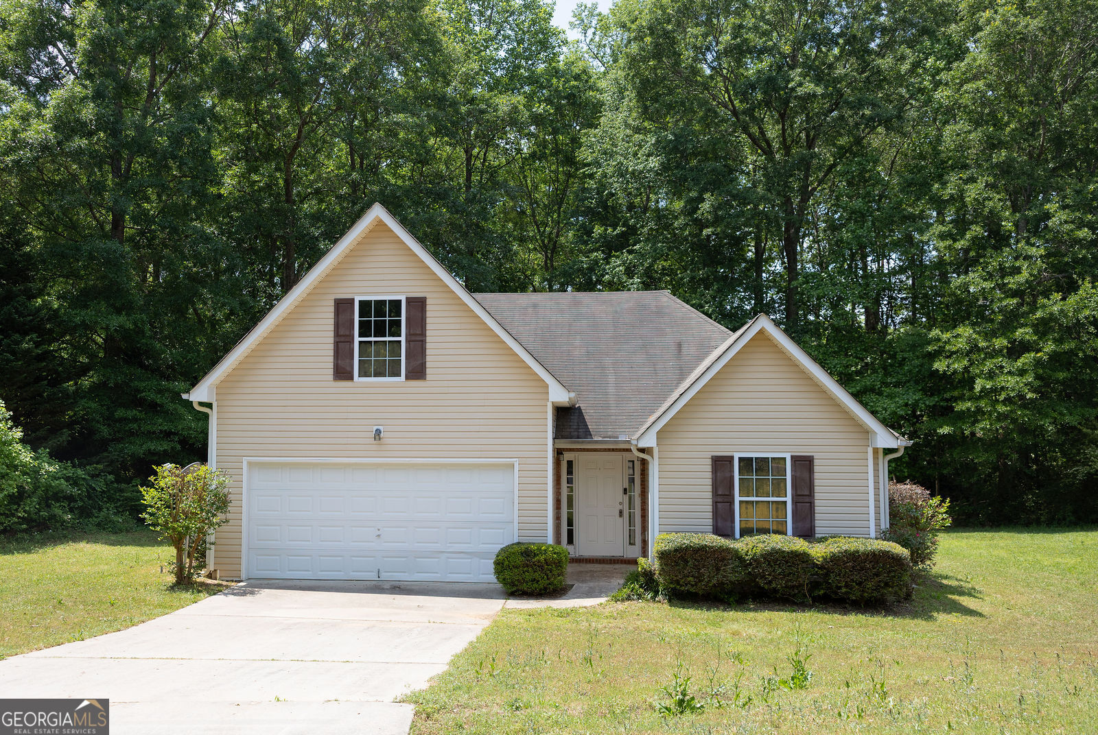 61 Concord Street North Concord, GA 30206 - Photo 1 of 37 a front view of a house with a yard