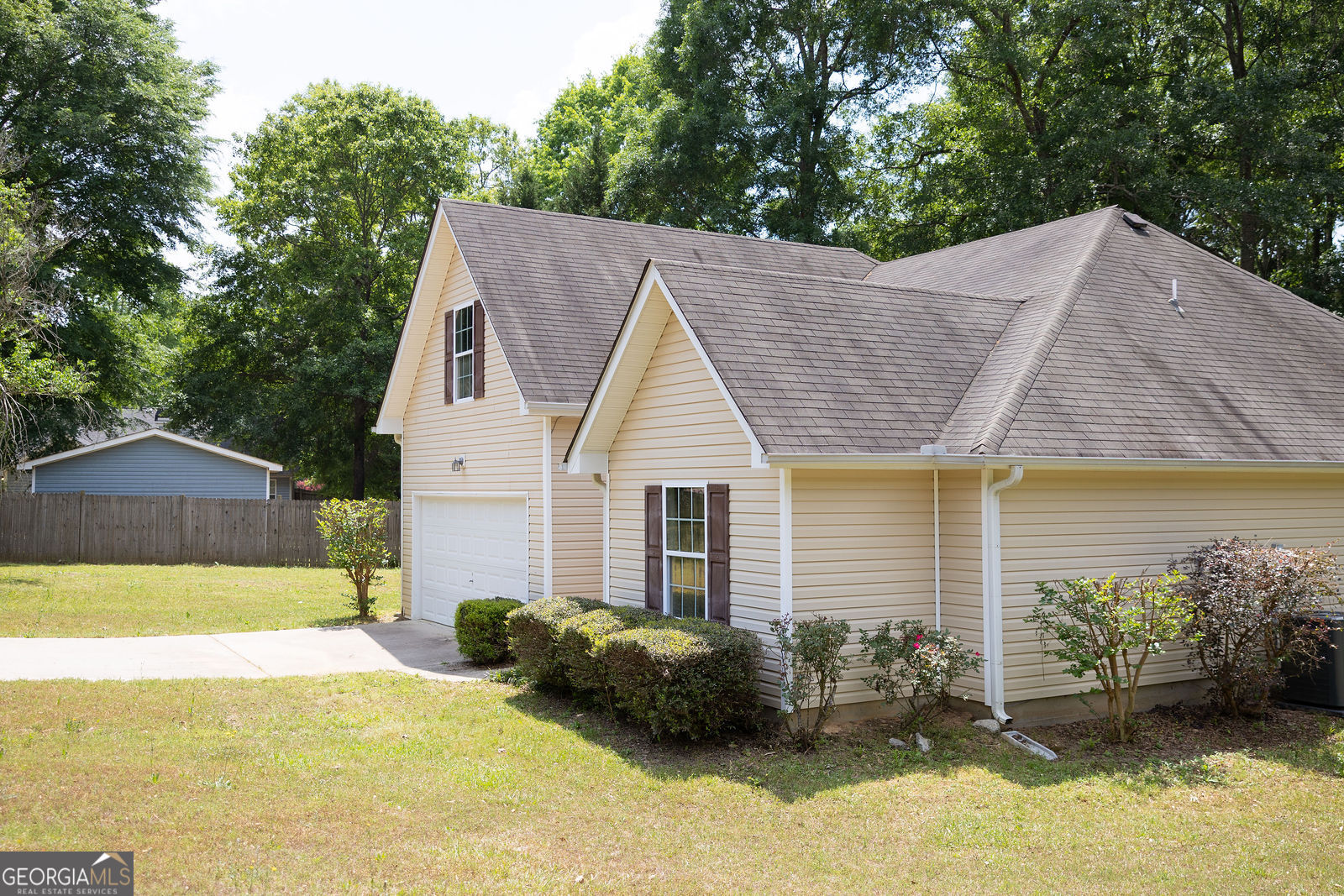 61 Concord Street North Concord, GA 30206 - Photo 2 of 37 a view of a house with a yard and large tree